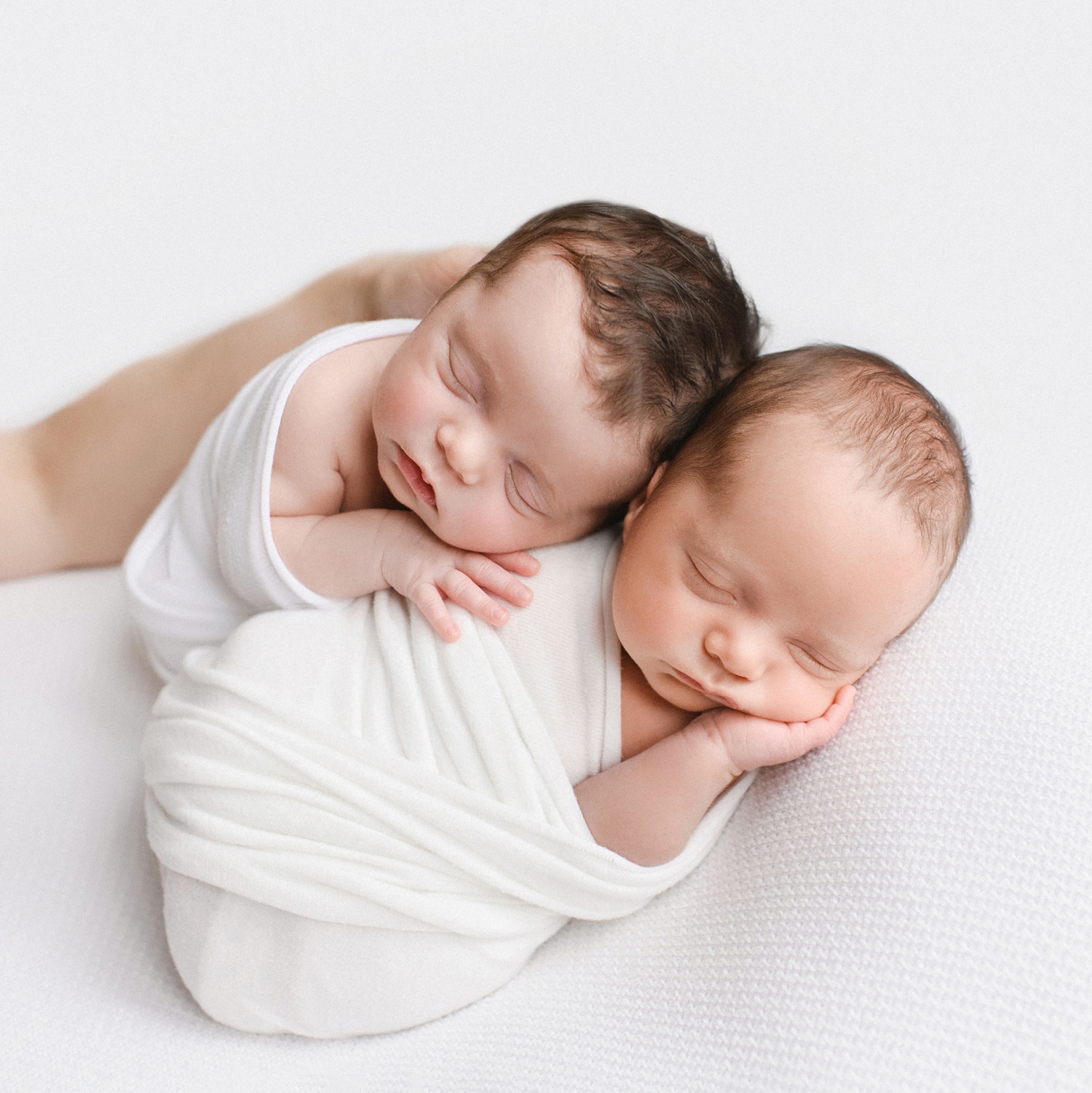 Newborn twins photographed at 3 weeks old.