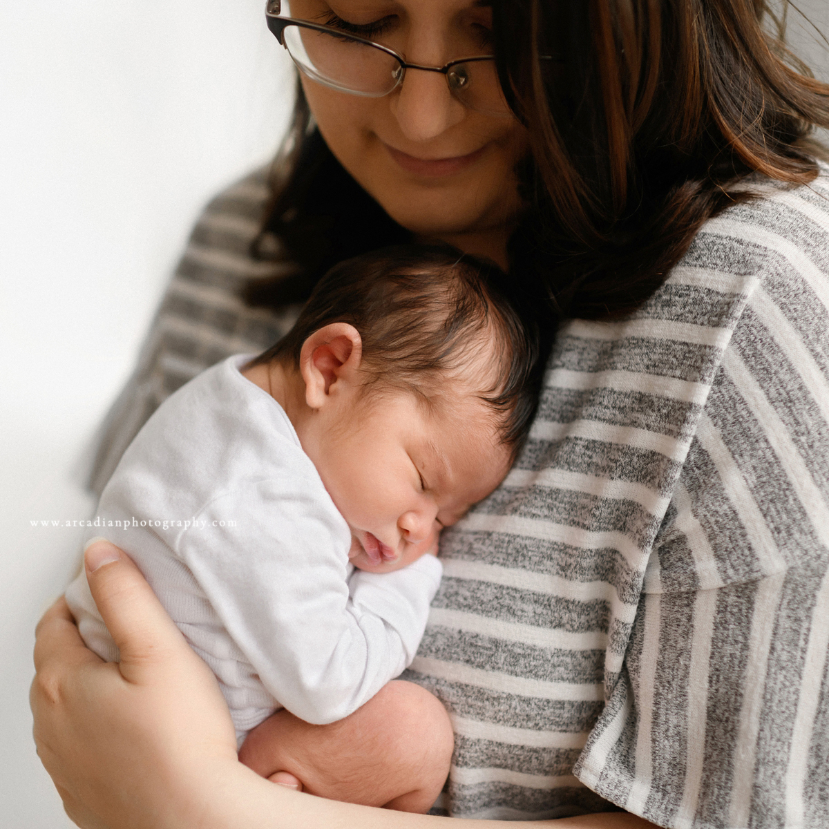 Snug as a bug - learn more about booking newborn photos.