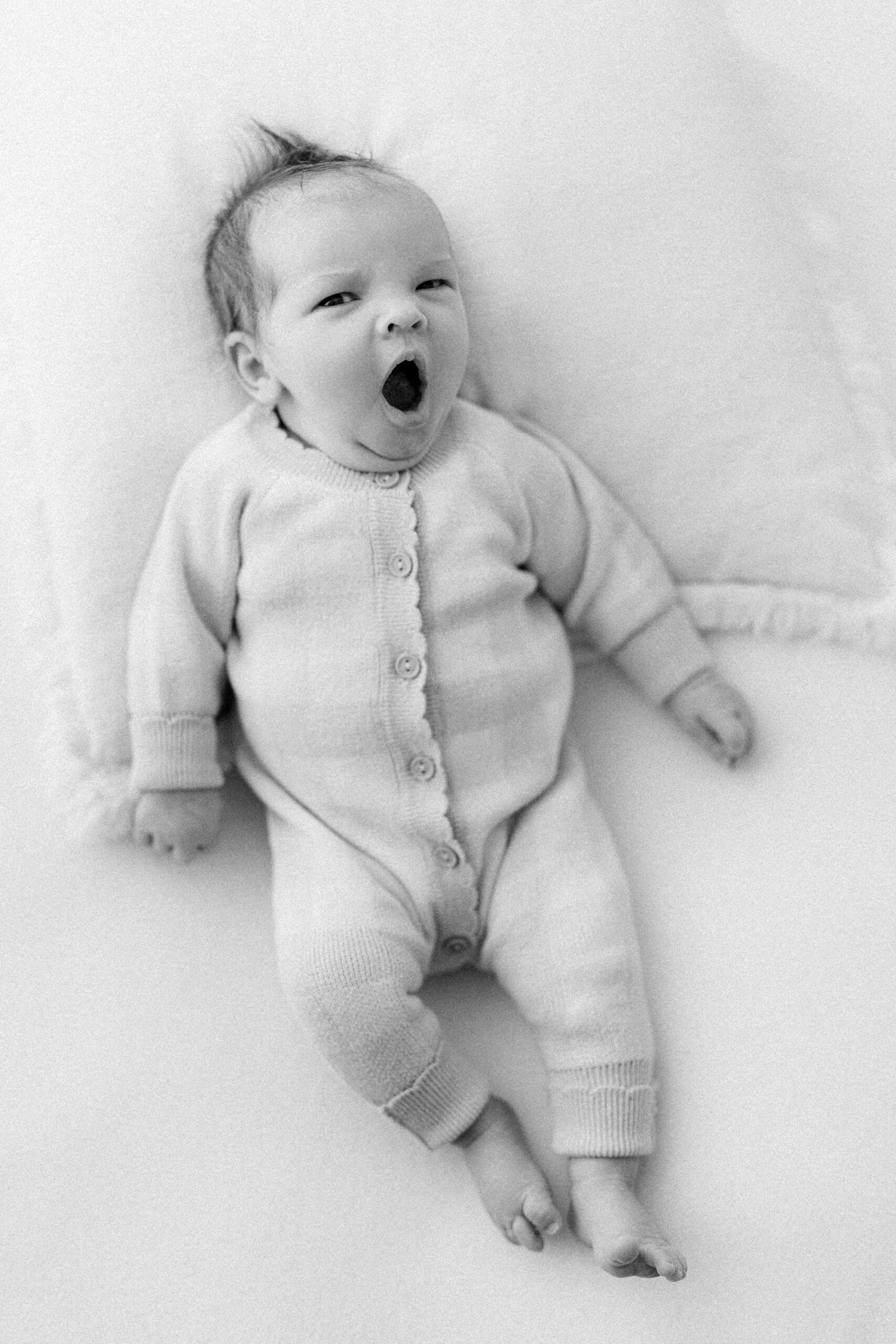 yawning 4 week old at her petite newborn session