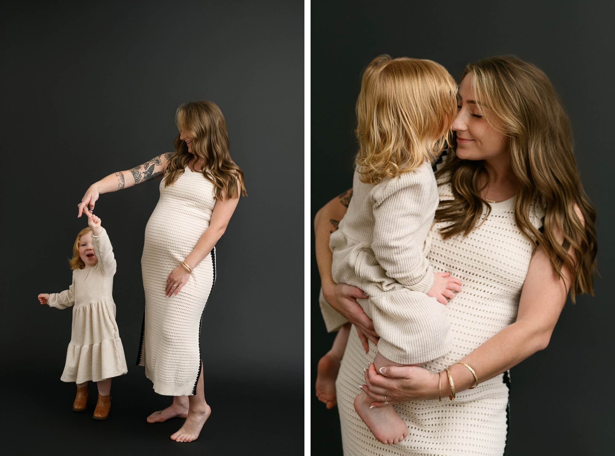 Expecting mother dancing with toddler in front of dark backdrop during maternity photos with partner and siblings in Portland, Oregon. Mother holding toddler nose-to-nose in intimate maternity photo with partner and siblings in Portland, Oregon.