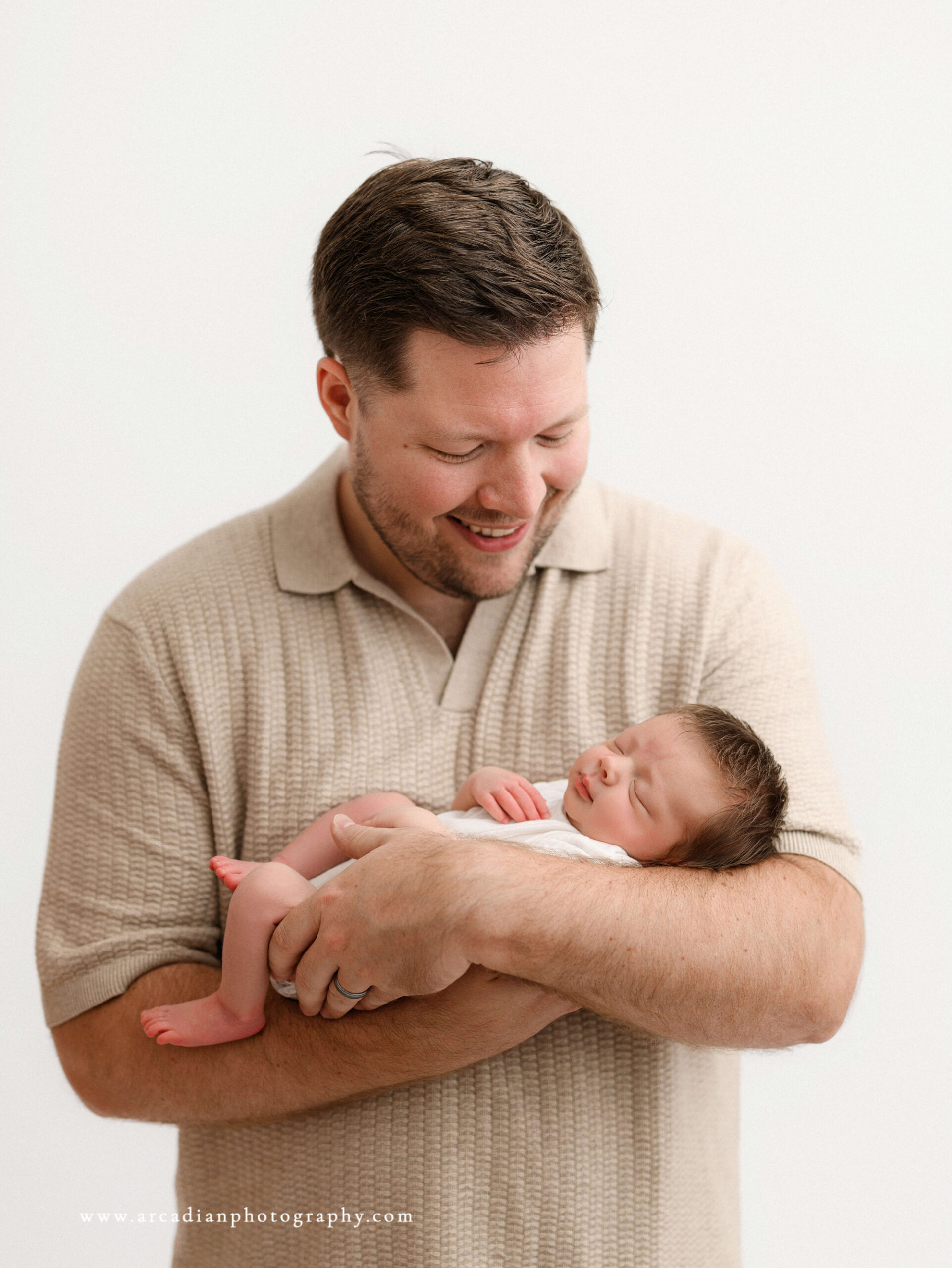 new dad with newborn baby
